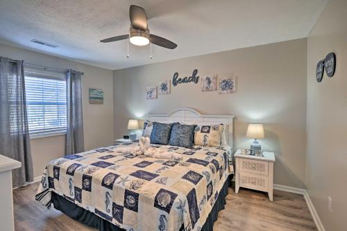 a bedroom with a bed and a ceiling fan at Swim, Golf, Play - Beachy River Oaks Condo! in Myrtle Beach