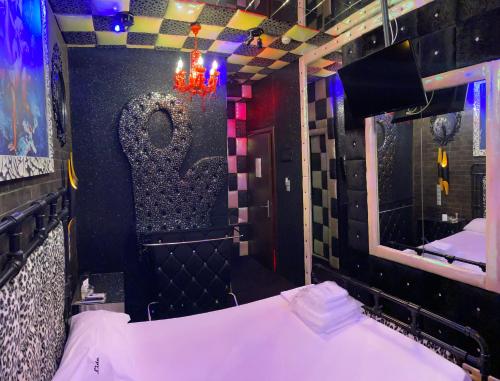 a room with a mirror and a bed in it at Lida Hotel in Athens