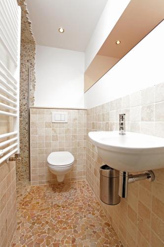 a bathroom with a sink and a toilet at Dreamtime Houseboat in Amsterdam