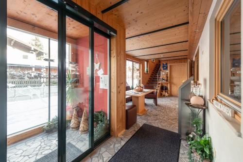 an internal view of a house with glass doors at Wellnesshaus Reichelt in Radstadt