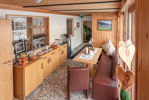 a kitchen and dining room with a table in a caravan at Wellnesshaus Reichelt in Radstadt