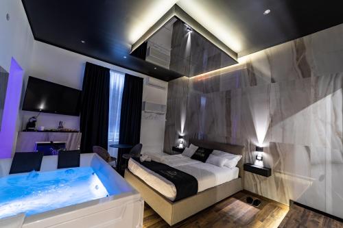 Cama o camas de una habitación en Maximum Suite & Spa