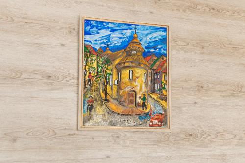 a painting hanging on a wall at Садиба Кичера та Кичера Еко in Mizhhirʼʼya
