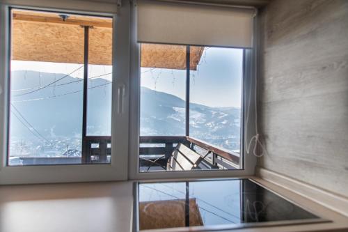 a window in a room with a view of a mountain at Садиба Кичера та Кичера Еко in Mizhhirʼʼya