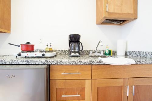 a kitchen with a stove and a counter top at The Gallery in Mexico City