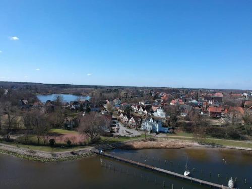 an aerial view of a town and a river at Wohnen am Seglerhafen mit Traveblick im Kontorhaus viele Extras in Lübeck