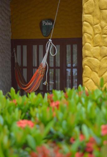 a reflection of a hammock in front of a building at Eco Hostal Kuima in El Zaino