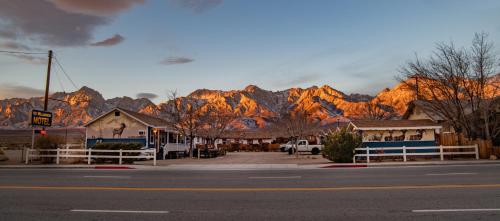 a view of a town with a mountain in the background at Mt Williamson Motel and Basecamp in Independence