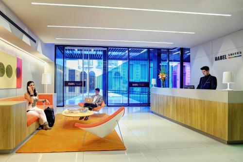 a group of people sitting in a lobby at Boutique Apartments - San Telmo in Buenos Aires