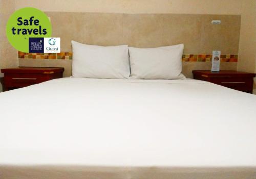 Postel nebo postele na pokoji v ubytování Hotel Guivá Huatulco