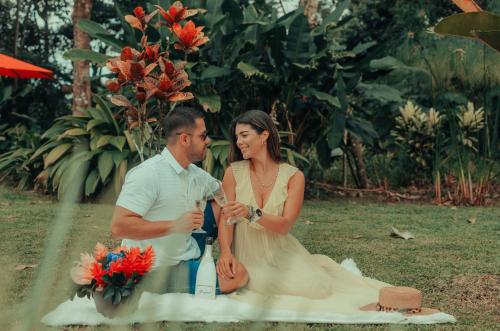 a bride and groom sitting next to each other at Yellow Tree Suites in Fortuna