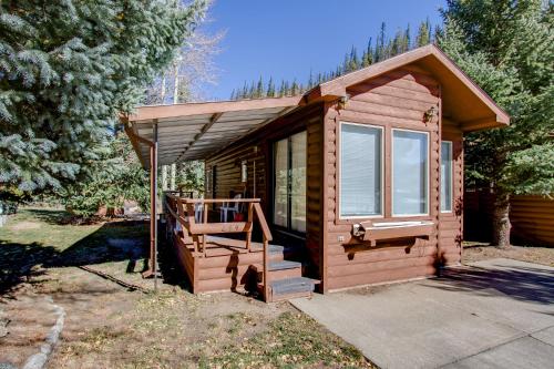 a small cabin with a porch and a staircase at #244 in Breckenridge