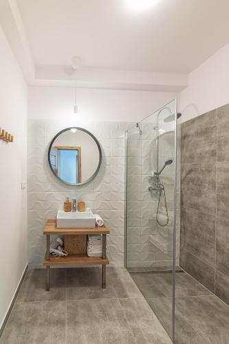 a bathroom with a sink and a shower at Aparthotel Central Liptovský Mikuláš in Liptovský Mikuláš