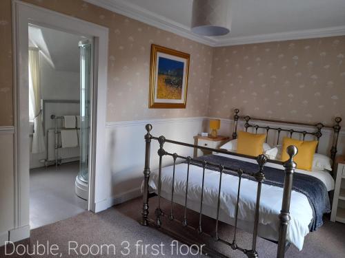 Cama o camas de una habitación en Buchan Guest House