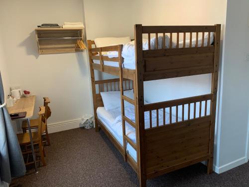 a couple of bunk beds in a room at The Victoria guest house in Mablethorpe