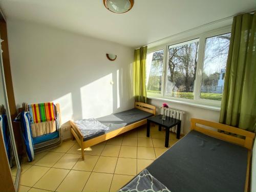 Postel nebo postele na pokoji v ubytování Ośrodek Wczasowy HELIOS