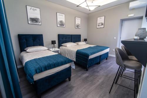 Postel nebo postele na pokoji v ubytování Apartments Azzurro Sarajevo