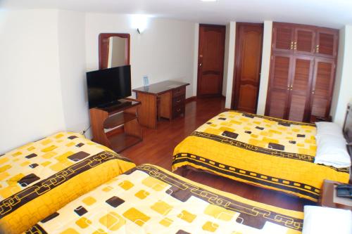 Hotel Santa Isabel 2 tesisinde bir odada yatak veya yataklar