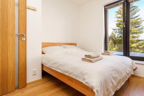 Postel nebo postele na pokoji v ubytování Horský apartmán Temari 4 Klínovec