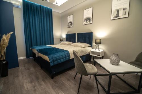 Posteľ alebo postele v izbe v ubytovaní Apartments Azzurro Sarajevo