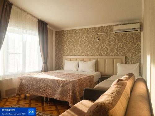 Кровать или кровати в номере Отель МИР