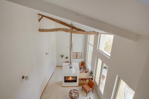 an overhead view of a living room with a fireplace at Badon Boutique Hotel in Saint-Émilion