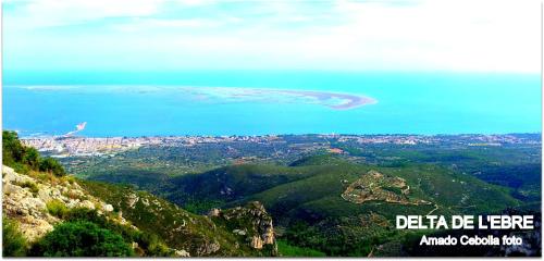 a view of the ocean from a mountain at Villa Paquita - Delta de l'Ebre in Deltebre