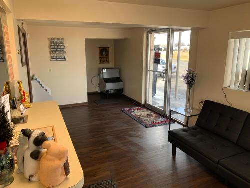 a living room with a couch and a table at Finn's Motel in Saint James