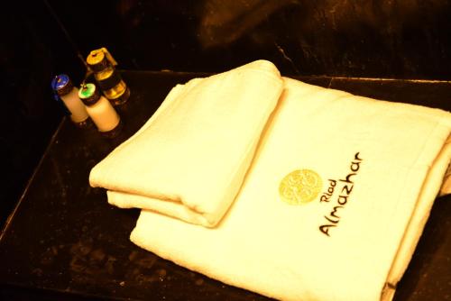 a towel on a table with the words faith on it at Riad Al mazhar in Rabat
