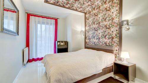 En eller flere senge i et værelse på Apartament 36 Gardenia Seaside - Aprent