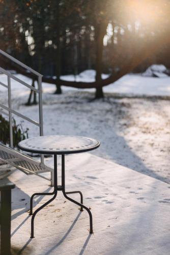 a table and a bench in a park at Leśniki in Babimost