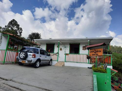 a car parked in front of a house at Hotel Casa Quinta Salento in Salento
