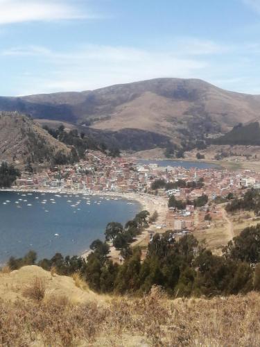a city on the shore of a body of water at Hostal Puerto Alegre in Copacabana