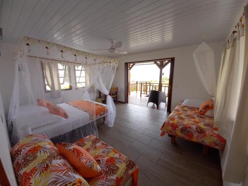 En eller flere senger på et rom på Fafapiti Lodge Fakarava