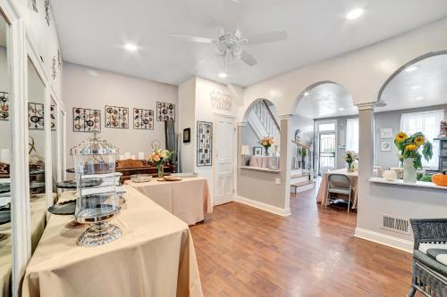 a large room with a table with a vase on it at Delightful Empowerment Palace in Philadelphia