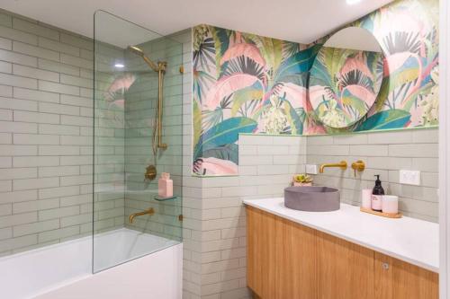 a bathroom with a sink and a shower at The Coconut Crib- Waterfront Burleigh Beach in Gold Coast