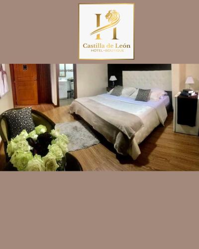 a bedroom with a bed and a chair in it at Hotel Boutique Castilla de Leòn in Cuenca