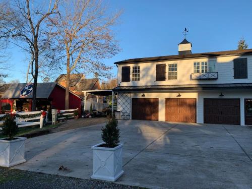 a house with a driveway and a garage at Boyd Harvey Main House & Carriage House in Knoxville