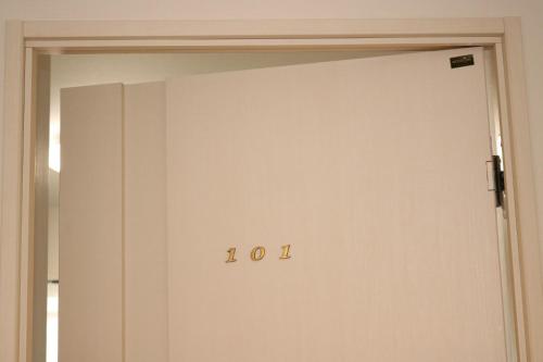 an open door with the number on it at Chiyoda-Home　Osu-sakae-Subways-JR trin-Spa-parking spot-WIFI in Nagoya