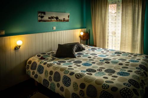 En eller flere senge i et værelse på Casa do Forno