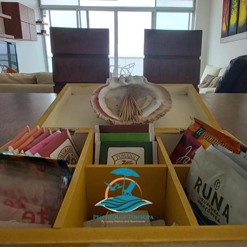 a pizza box sitting on top of a table at Discoverequador in Tonsupa