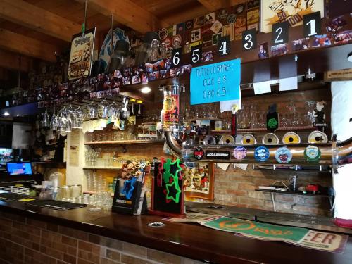 a bar with a sign that reads think out of trips at Bobo’s Home in Iglesias
