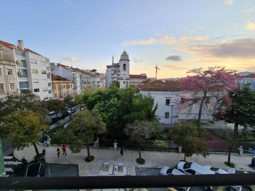 a view of a city with trees and buildings at Shangri-La Hostel Anjos in Lisbon