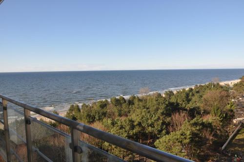 a view of the ocean from a balcony at Promenada28pl - Apartamenty z widokiem na morze in Międzyzdroje