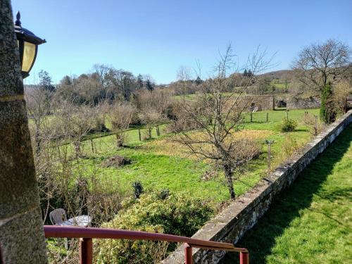 a view of a field from the balcony of a house at le gite du jardinier in Saint-Martin-lʼAiguillon