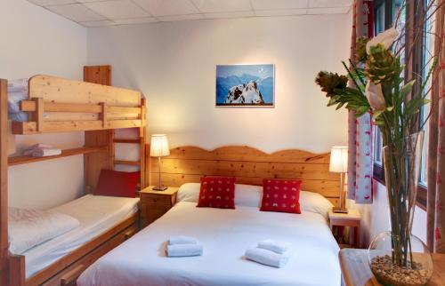 Säng eller sängar i ett rum på Les Campanules
