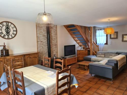 a living room with a couch and a table at Maison familiale Bolquère in Bolquere Pyrenees 2000