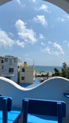 a view of the ocean from the balcony of a condo at 海灘戀情 Beach Love 近沙灘-國旅卡特約商店 陽台房 希臘地中海風格 in Eluan