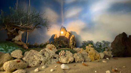a model of a house with a light in the background at 海灘戀情 Beach Love 近沙灘-國旅卡特約商店 陽台房 希臘地中海風格 in Eluan