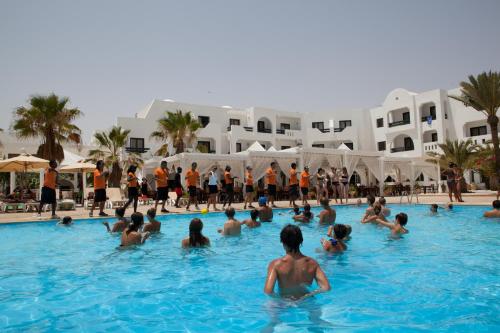a group of people in a swimming pool at Seabel Aladin Djerba in Aghīr
